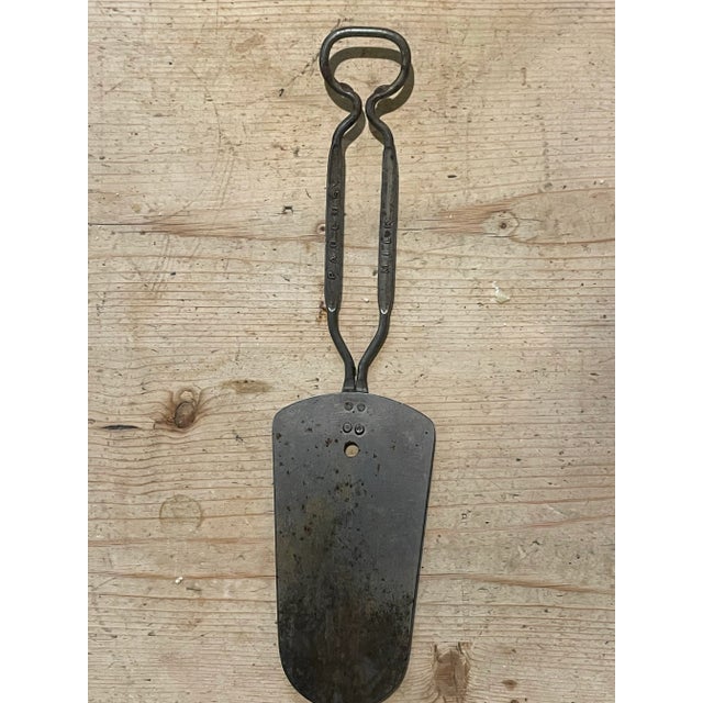 A set of early 20th century baking tools including advertising merchandise. The set features: a Swans Down Flour cake pan...