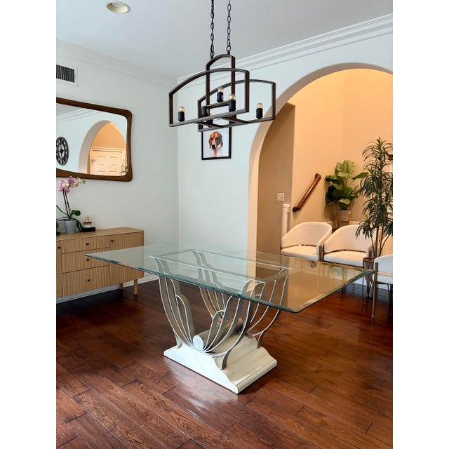 Stunning, sculptural Art Deco style "Butterfly" dining table with glass top. This unique mid-century statement piece...