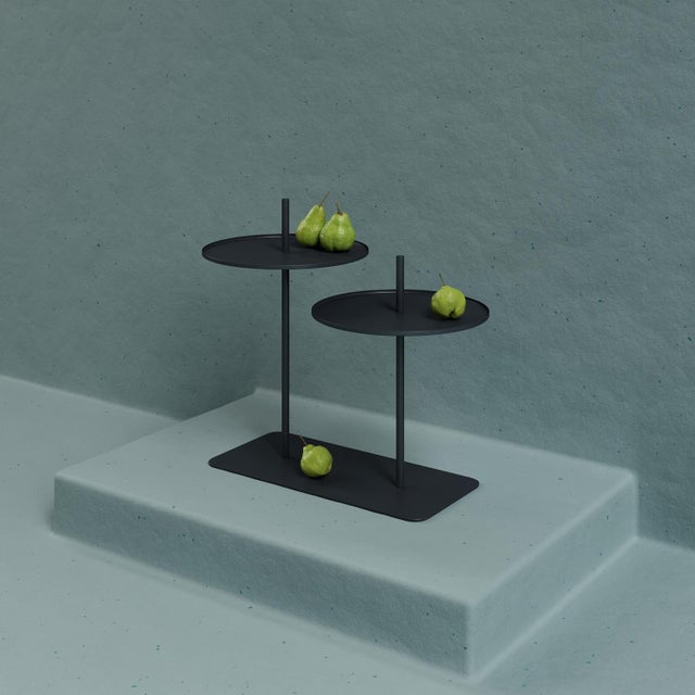 Lily is a basic minimalist double top table with an elegant shape. It can be used beside an armchair, sofa or bed. The...