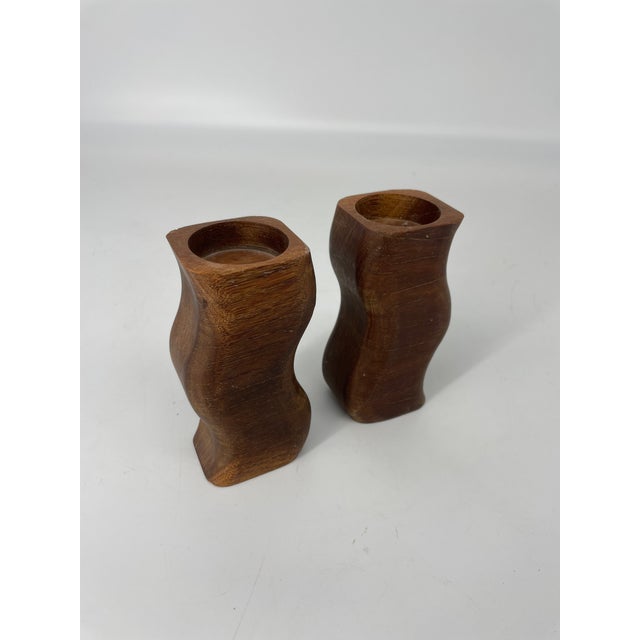 A charming pair of rustic farmhouse swizzle wooden candleholders.