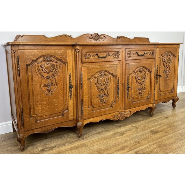 Bring timeless French elegance into your home with this beautiful Vintage French Louis sideboard, expertly crafted in oak...