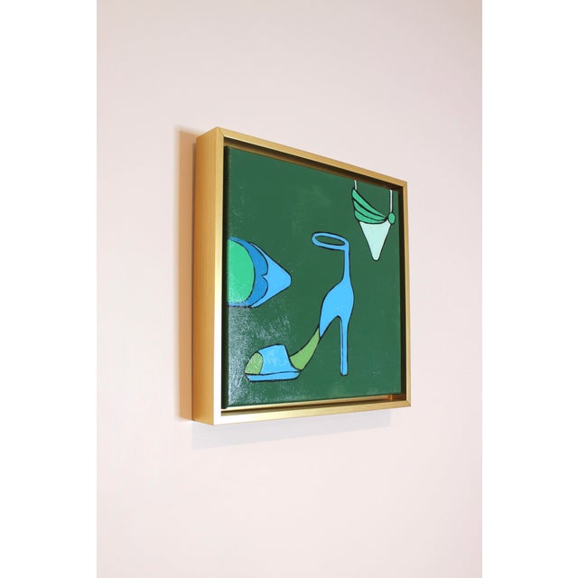Dark green painting featuring three stylish shoes and a classy gold frame. Featuring Angela's fashionable subject matter,...