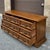 A late 20th century Henredon Fine Furniture Spanish Revival oak low triple dresser having nine dovetailed drawers with...