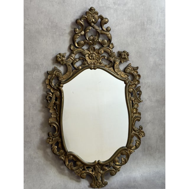 Magnificent baroque mirror in gilded wood from the 1950s. France