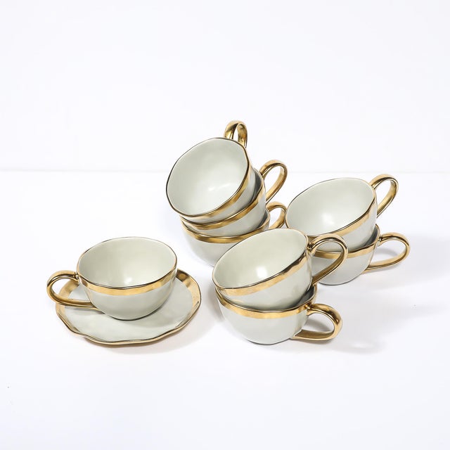 This modernist tea/coffee service for eight, designed by Tania Bulhões and crafted in Brazil during the 20th century,...