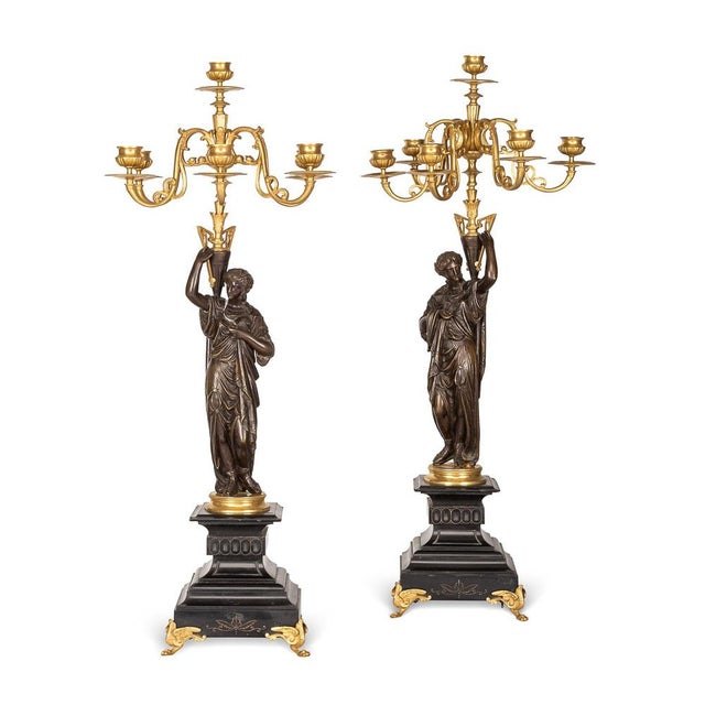 Antique 19th Century French pair of bronze candelabra each formed as a standing female figure holding a gilt-bronze 7...