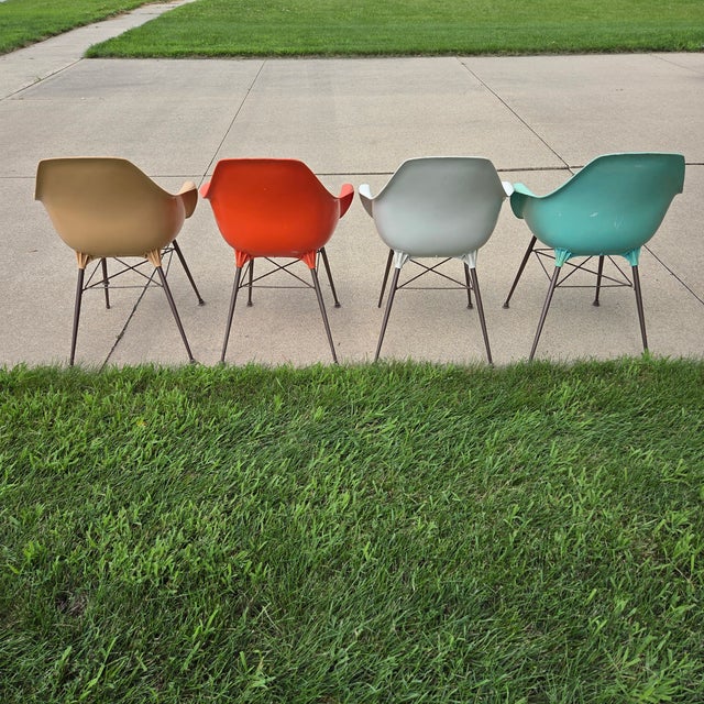 Vintage molded plastic bucket chairs in the style of Aladdin chairs by Sam Avedon from the 1960s. Add retro Chico to your...