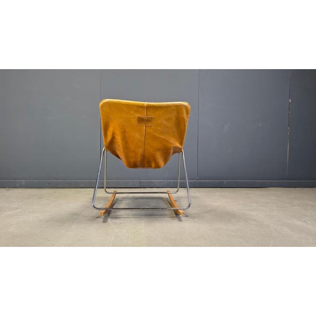 Mid century rocking chair model 'g1' designed by pierre guariche for meurop. Camel leather upholstery on a chromed metal...