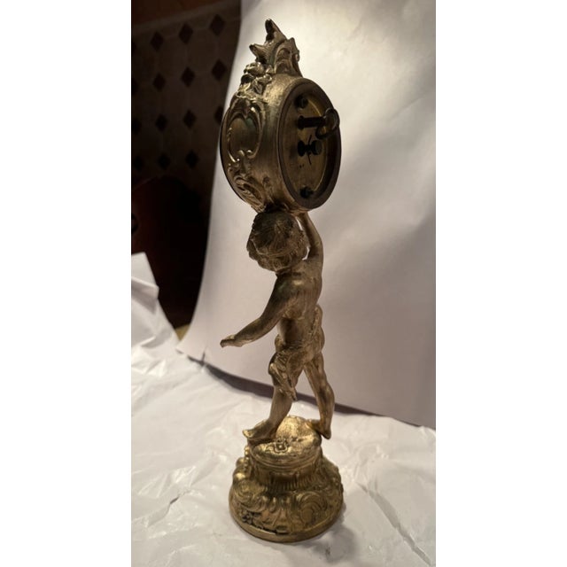 This listing is for a gorgeous antique desk clock by the Jennings Brothers. The clock is made from cast metal with a gilt...