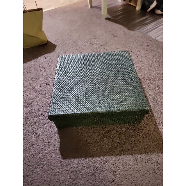 This charming vintage woven palm leaf lidded container is a delightful fusion of practicality, craftsmanship, and elegant...