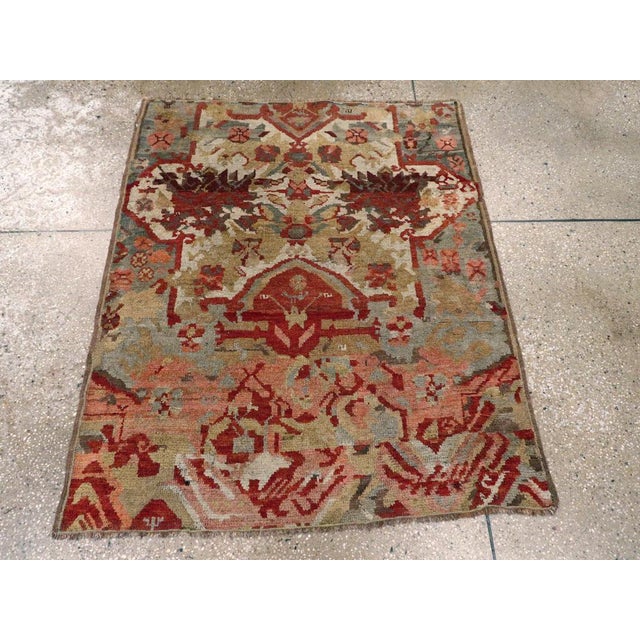 An antique Turkish Caucasian Karabagh throw rug handmade during the Early 20th century. Measures: 3' 4" x 4' 1"