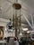 Design Plus Gallery presents a Ten-Light Pendant Chandelier in the style of Jonathan Browning. A circular bronze-toned...