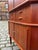 This teak corner cabinet from Aulum Møbelfabrik in Denmark offers ample storage in a compact space and is a true mid-...