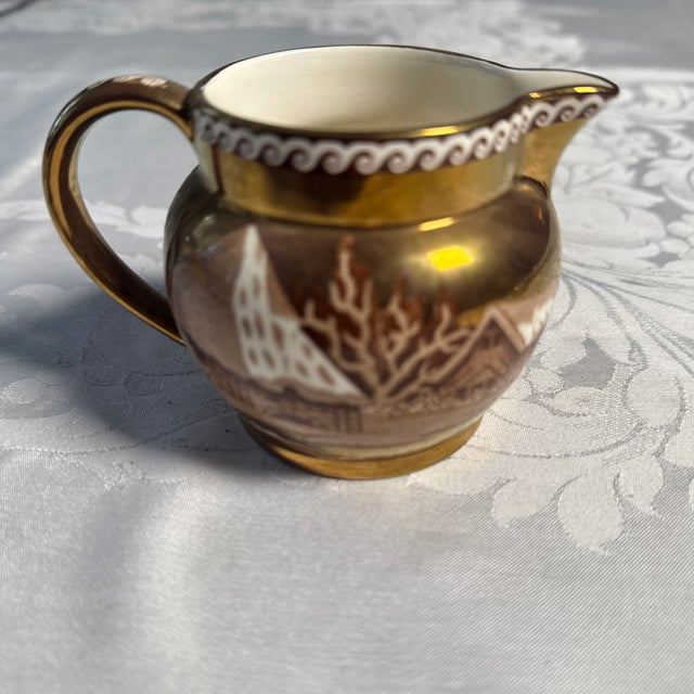 Wedgwood “Fallow Deer” Copper Luster Creamer. 3” high x 2.5” wide at rim (not including spout. Excellent estate condition.