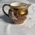Wedgwood “Fallow Deer” Copper Luster Creamer. 3” high x 2.5” wide at rim (not including spout. Excellent estate condition.