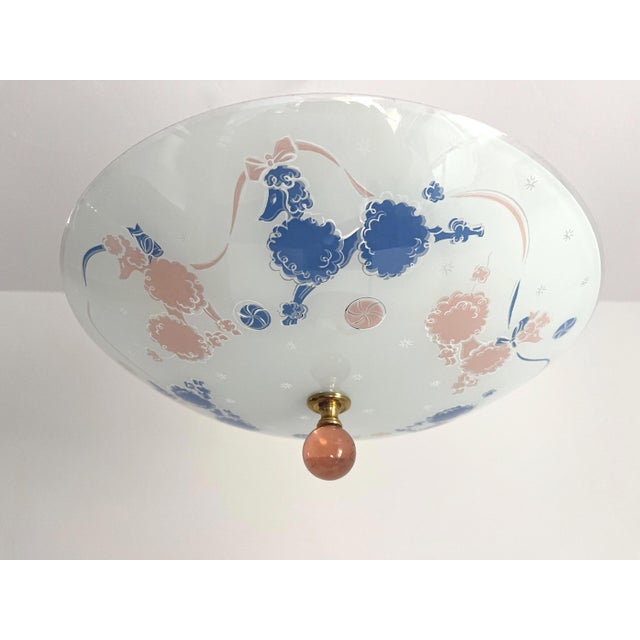 Adorable mid century frosted glass ceiling light reverse painted with a colorful ring of blue and pink French cut poodles,...