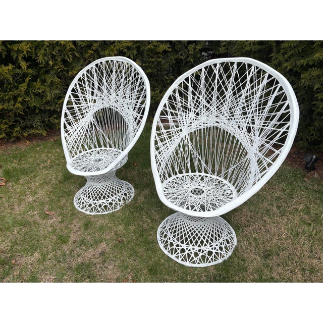 Vintage Russel Woodward white fiberglass peacock chairs. A pair! Chairs are made of fiberglass and endure weather well!...