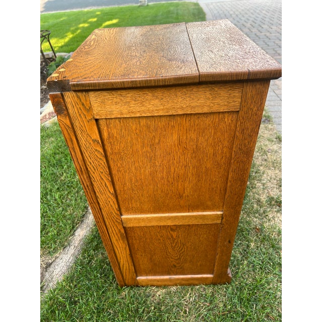 This is a very unique and cool cabinet. It is oak and has the original hardware. It looks like it may have had a mirror...