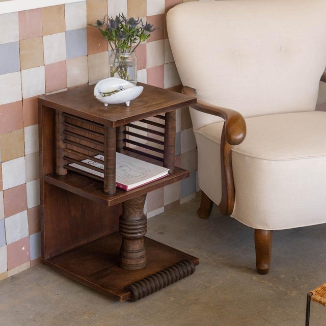 Beautiful carved wood end table by Charles Dudouyt from France, 1940's. Ornately carved slat and column detail with one...