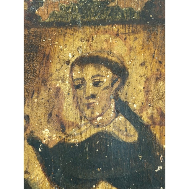 A charming Spanish Colonial hand-painted devotional retablo depicting Saint Dominic, founder of the Dominican Order. The...