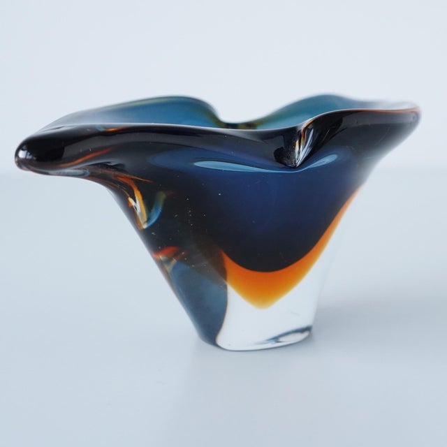 Vintage mid 20th century Murano Sommerso glass catchall or vide poche. Blue glass submerged in orange glass suspended...