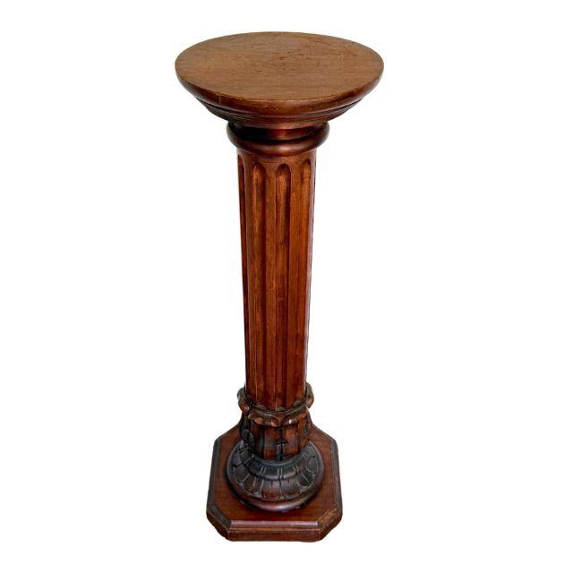 A gorgeous mid-century Italian wooden pedestal with a round top. The columnar body with vertical fluting sits perfectly on...