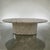 Beautiful vintage tessellated stone coffee table, oval in shape. This table has brass inlay on the top and on the base, in...