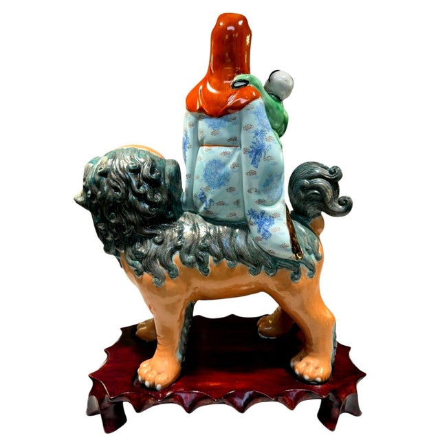 Vintage Chinese Porcelain Immortal with Child Riding Guardian Foo Lion – 15" – Marked 082 – Wooden Display Base An...