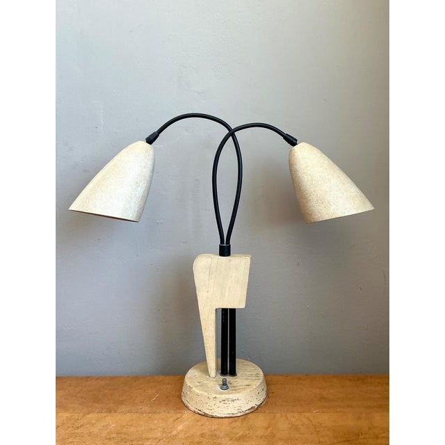 Embodying the playful organic forms of atomic-era design, this vintage mid-century modern double arm table lamp features...