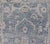 This Oushak Runner is rendered in a medium blue background and a light grey border. The design is an arabesque-like floral...