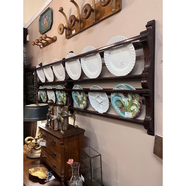 Imported from Belgium. Two tier wall mounted plate display rack. Beautiful carved details on the end and center brackets....