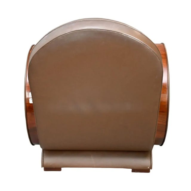 Add a touch of sophistication to your home with this Art Deco Style Brown Leather and Walnut Arm Chair. The chair boasts a...
