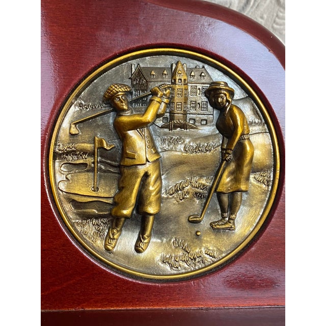 A gorgeous pair of bookends with bronze medallions depicting a couple golfing in front of a Scottish castle. Beautiful set!