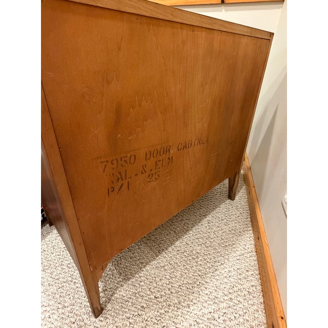 Beautiful vintage wooden cabinet with a warm, rich wood finish and classic mid-century styling. Features two paneled...