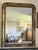 A substantial mirror with a continental journey—originally bought in France and brought to Rome generations ago by Mario's...