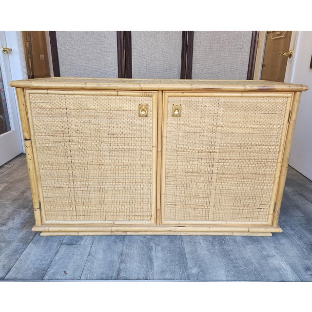 Beautiful vintage bamboo and wicker credenza from Italian maker, Dal Vera (circa 1970s). A fabulous piece that can be used...