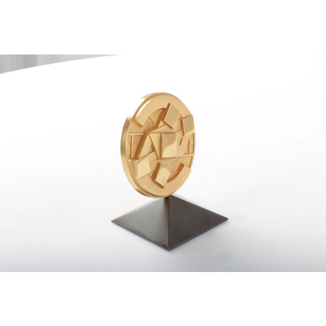 They have a signature of Giò Pomodoro. This piece is attributed to the mentioned designer/maker. It has no attribution...