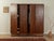 Wonderful Art Deco wardrobe from the 1920s. High-quality walnut veneer body with four doors, seven shelves, two interior...