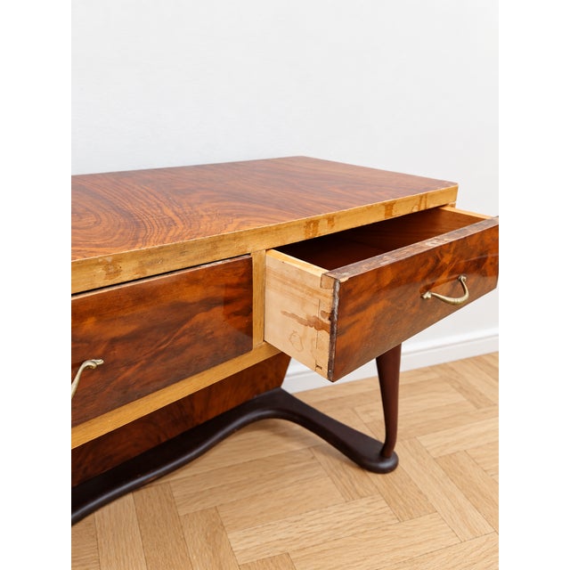 An elegant console table (also usable as a writing desk or vanity) dating back to the Italian Art Deco period, dating from...