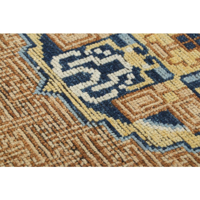 This 2x3 oriental rug draws inspiration from Chinese Kangxi-era design traditions, known for their refined geometry and...