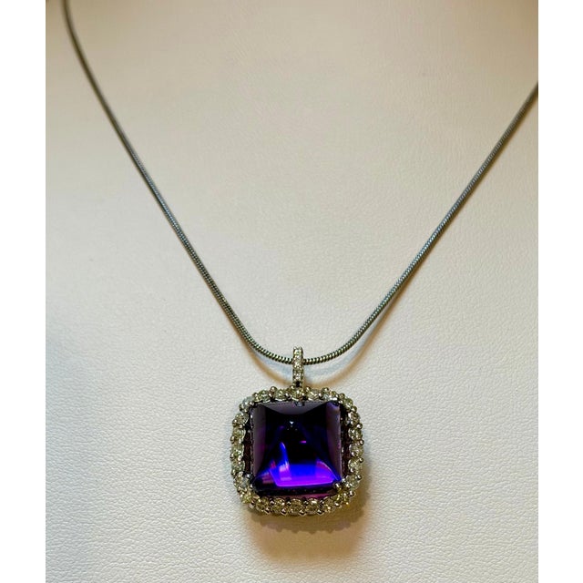Approximately 15 Carat Sugar Loaf Amethyst pendant with diamonds in 14 Karat White gold Amethyst is 15 mm X 15mm...