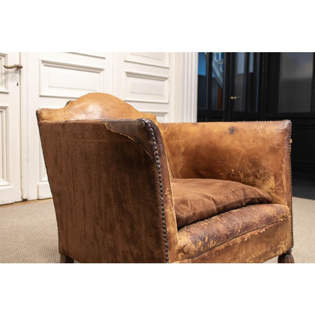 Elegant early 20th century French lounge chair, executed in the spirit of Louis Chambry, combining sculptural form with...