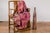 A tall and slender brown ceramic vase with textured finish and narrow mouth. This contemporary tall and slender brown...