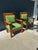 Sturdy pair of Mission style armchairs. Constructed from solid oak with a rich wood grain. Each chair has green leather...