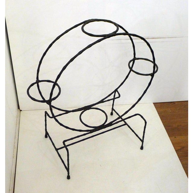 Small plant stand, round with openwork, two large circles (50 cm diameter), supporting 4 pot holders (pot holder diameter...