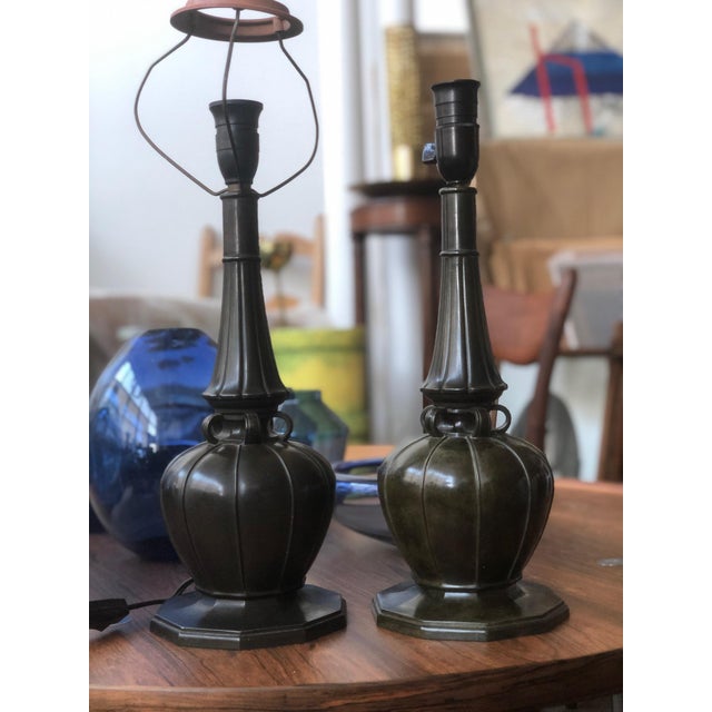 A large table lamp by Just Andersen, Denmark, circa 1930. Patinated disco metal, marked: Just Denmark 2239. The metal base...