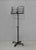 Adjustable black wrought iron lectern. The book support is adjustable in its inclination and its telescopic pole is...