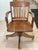 Beautiful, structurally pristine antique bankers desk chair dating from the early 20th century (circa 1910–1930). Crafted...