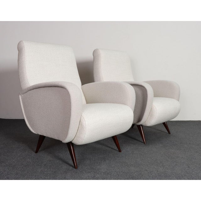 Pair of club/lounge chairs in the manner of Marco Zanuso (ca. 1950s, Italy). Elegant, sculptural form with exaggerated...