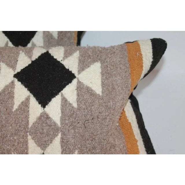 Pair of hand woven bolster pillows in fine condition. The backing is in cotton linen backing.